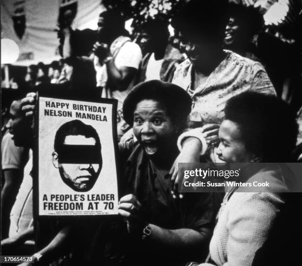 Women participate in an illegal rally at Western Cape University in celebration of the 70th birthday of imprisoned anti-apartheid leader Nelson...