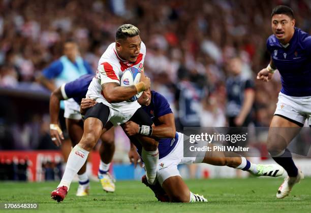 Lomano Lemeki of Japan is tackled by Christian Leali'ifano of Samoa during the Rugby World Cup France 2023 match between Japan and Samoa at Stadium...