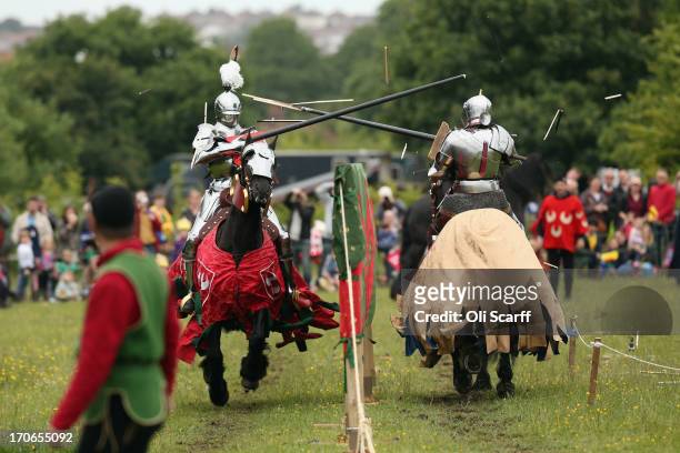 Re-enactors dressed as knights stage a medieval jousting competition at Eltham Palace on June 16, 2013 in Eltham, England. The 'Grand Medieval Joust'...