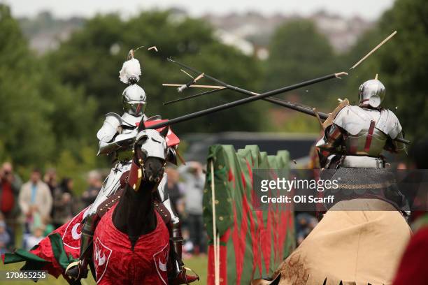 Re-enactors dressed as knights stage a medieval jousting competition at Eltham Palace on June 16, 2013 in Eltham, England. The 'Grand Medieval Joust'...