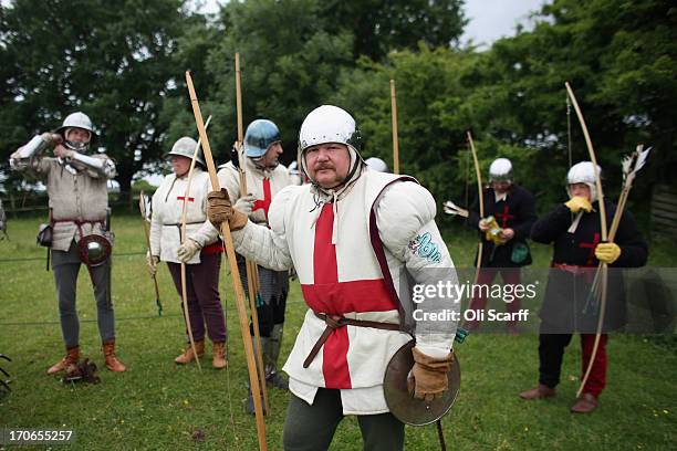 Re-enactors in period costume prepare to stage a medieval battle at Eltham Palace on June 16, 2013 in Eltham, England. The 'Grand Medieval Joust'...