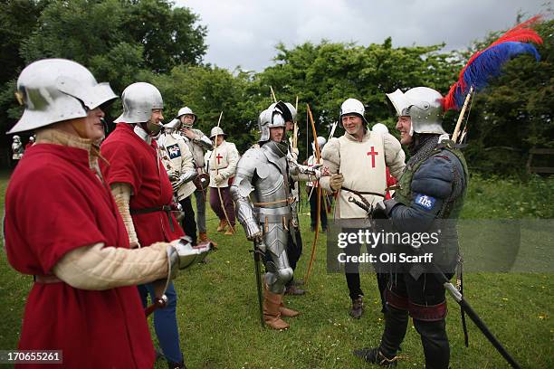 Re-enactors in period costume prepare to stage a medieval battle at Eltham Palace on June 16, 2013 in Eltham, England. The 'Grand Medieval Joust'...