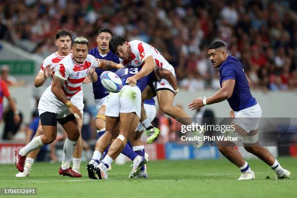 Ryoto Nakamura of Japan is tackled by Tumua Manu of Samoa during the Rugby World Cup France 2023 match between Japan and Samoa at Stadium de Toulouse...