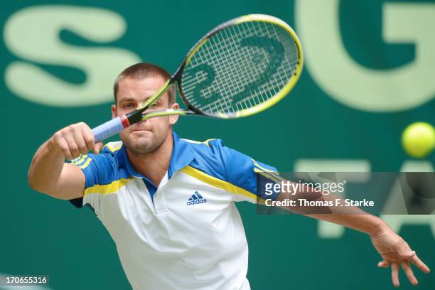 Mikhail Youzhny of Russia play a forehand in the final match against Roger Federer of Switzerland during the final day of the Gerry Weber Open at...
