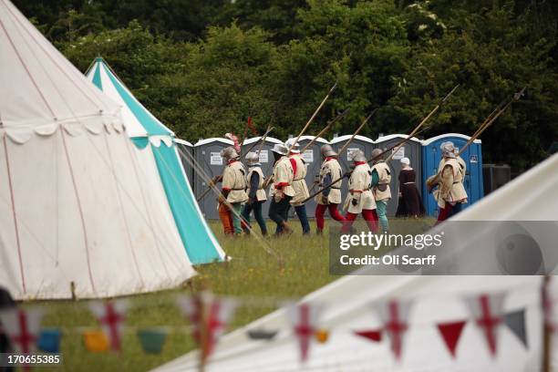 Re-enactors in period costume prepare to stage a medieval battle at Eltham Palace on June 16, 2013 in Eltham, England. The 'Grand Medieval Joust'...