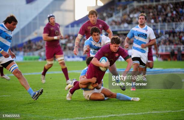 England player Freddie Burns dives over to score the first try during the second test match between Argentina and England at the Stadium Velez...