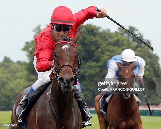 French jockey, Thierry Jarnet is about to cross the finish line to win on Treve the 164th Prix de Diane, a 2100-metre flat horse race open to...