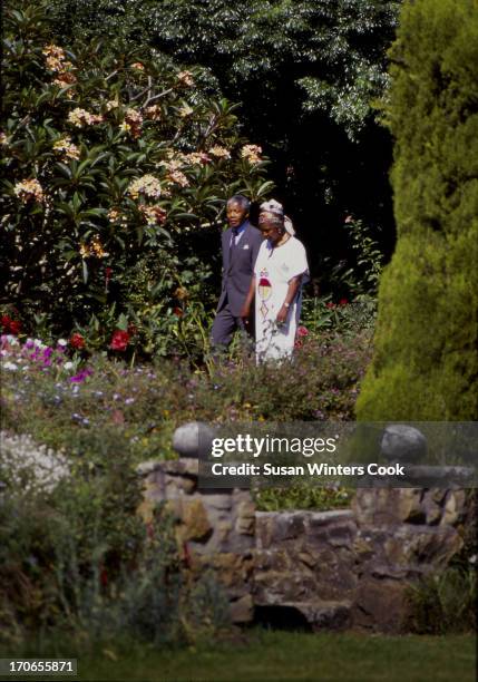 Shortly after his release from prison, South African anti-apartheid leader Nelson Mandela walks with his wife, Winnie Mandela, at Desmond Tutu's...