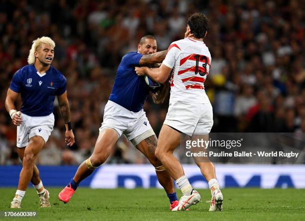 Ed Fidow of Samoa is tackled by Dylan Riley of Japan during the Rugby World Cup France 2023 match between Japan and Samoa at Stadium de Toulouse on...