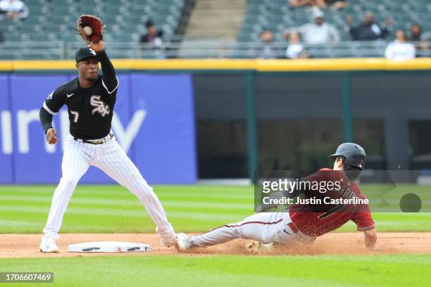 Corbin Carroll of the Arizona Diamondbacks steals second while defended by Tim Anderson of the Chicago White Sox in the first inning at Guaranteed...