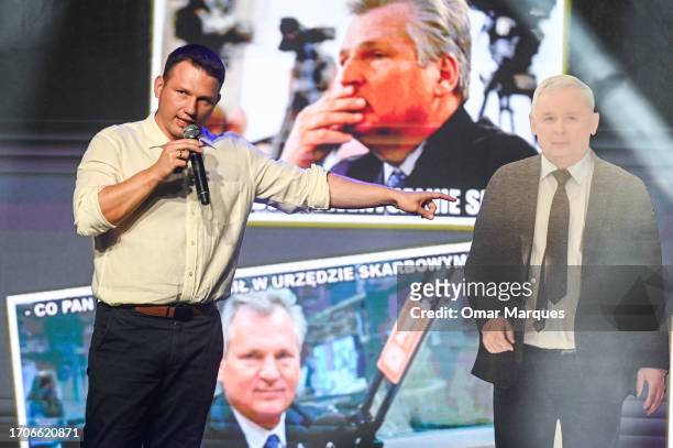 Slawomir Mentzen, leader of Poland’s Far Right Konfederacja Party points to a banner with the leader of Law and Justice, Jaroslaw Kaczynski during a...