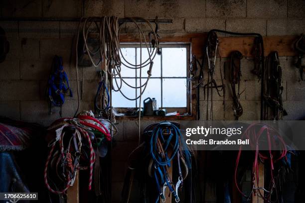 Steve Vigil's ancestral chaps and belongings are seen hanging in his home on September 27, 2023 in Cundiyo, New Mexico. "My house was built in 1850....