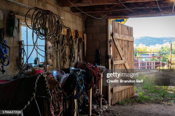 Steve Vigil's ancestral chaps and belongings are seen hanging in his home on September 27, 2023 in Cundiyo, New Mexico. "My house was built in 1850....