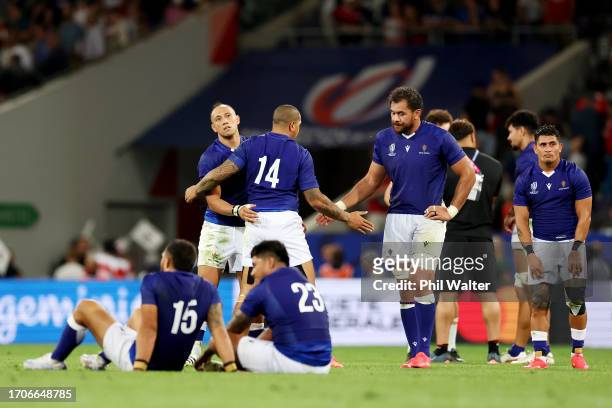 Ed Fidow and Chris Vui of Samoa shake hands at full-time following the Rugby World Cup France 2023 match between Japan and Samoa at Stadium de...