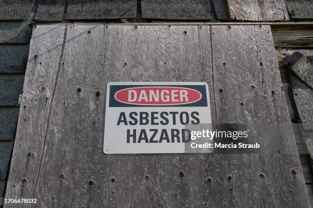 danger asbestos hazard sign - asbestos stock pictures, royalty-free photos & images