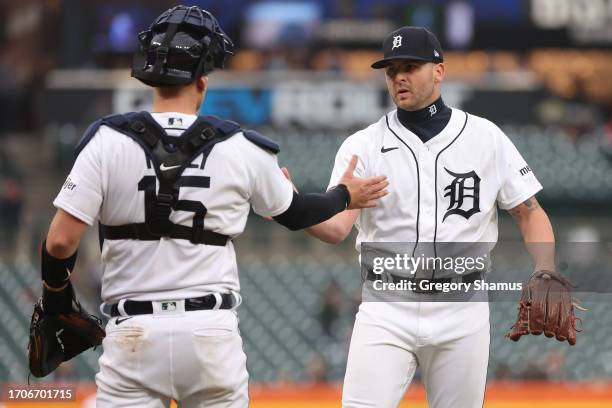 Alex Lange of the Detroit Tigers celebrates a 7-3 win over the Kansas City Royals with Carson Kelly at Comerica Park on September 28, 2023 in...