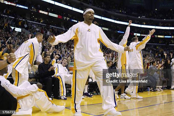 Guard Derek Fisher of the Los Angeles Lakers celebrates during the game against the Sacramento Kings at Staples Center on December 25, 2002 in Los...