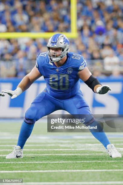 Graham Glasgow of the Detroit Lions blocks during a game against the Atlanta Falcons at Ford Field on September 24, 2023 in Detroit, Michigan.