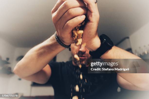 biscuit crumbs from the hands, cooking at home - miga fotografías e imágenes de stock