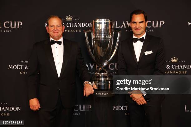 President and CEO Tony Godsick of Team8 and former ATP player Roger Federer pose with the Laver Cup trophy ahead of the Laver Cup at Rogers Arena on...