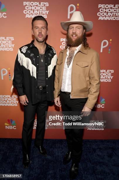 Pictured: T.J. Osborne and John Osborne of Brothers Osborne arrive to the 2023 People's Choice Country Awards held at the Grand Ole Opry House on...