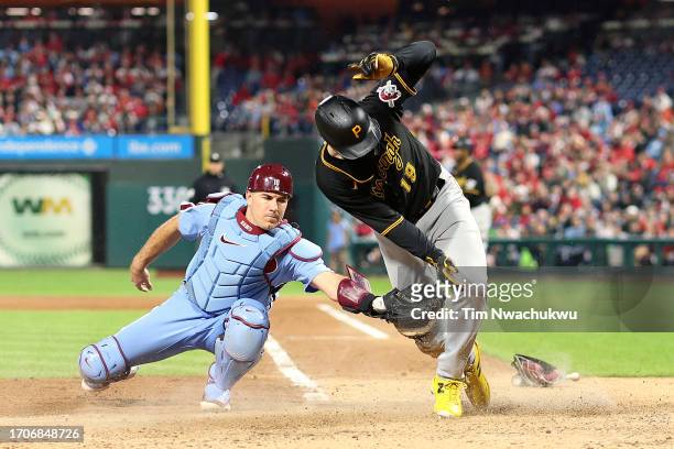 Jared Triolo of the Pittsburgh Pirates scores a run past J.T. Realmuto of the Philadelphia Phillies during the fifth inning at Citizens Bank Park on...