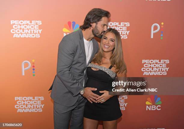 Pictured: Eric Decker and Jessie James Decker arrive to the 2023 People's Choice Country Awards held at the Grand Ole Opry House on September 28,...
