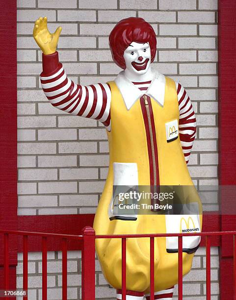 Waving Ronald McDonald figurine is visible outside a McDonald's fast-food restaurant January 2, 2003 in Des Plaines, Illinois. The Oak Brook,...