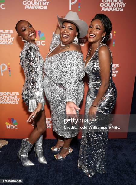 Pictured: Trea Swindle, Danica Hart, and Devynn Hart of Chapel Hart arrive to the 2023 People's Choice Country Awards held at the Grand Ole Opry...