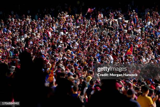 Lions fans show their support during a Brisbane Lions AFL training session at Melbourne Cricket Ground on September 29, 2023 in Melbourne, Australia.