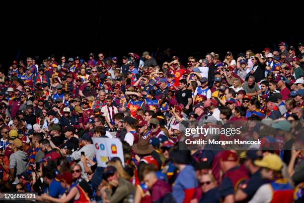 Lions fans show their support during a Brisbane Lions AFL training session at Melbourne Cricket Ground on September 29, 2023 in Melbourne, Australia.