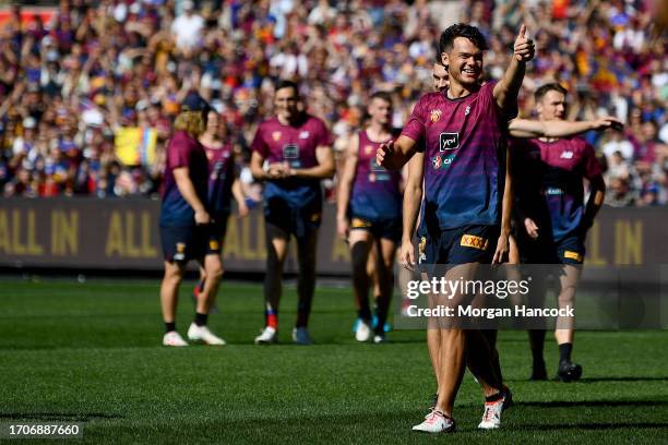 Cam Rayner of the Lions greets fans during a Brisbane Lions AFL training session at Melbourne Cricket Ground on September 29, 2023 in Melbourne,...