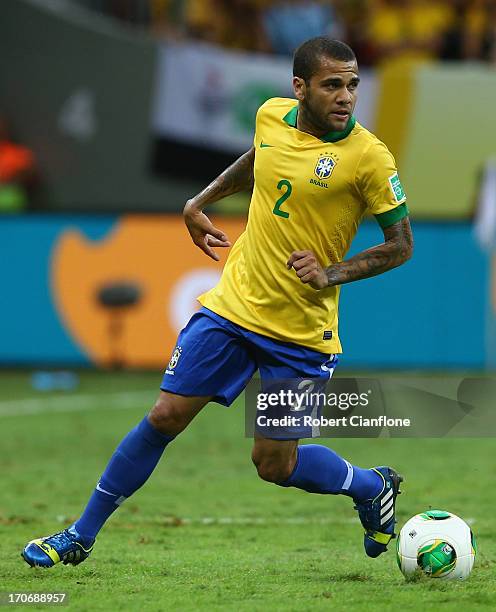 Daniel Alves of Brazil in action during the FIFA Confederations Cup Brazil 2013 Group A match between Brazil and Japan at National Stadium on June...