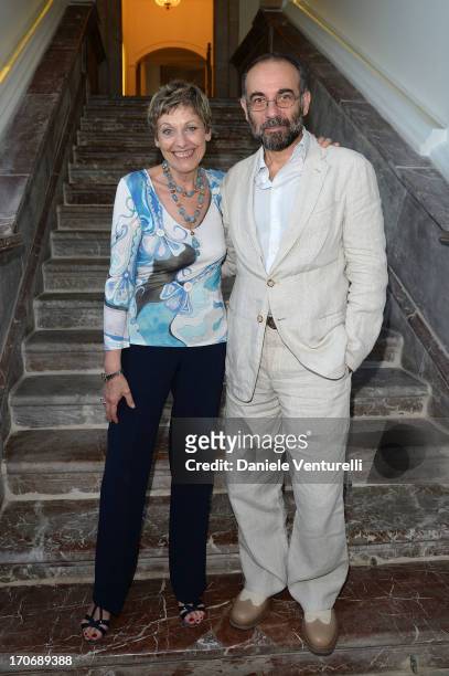 Director Giuseppe Tornatore poses with Gloria Satta at Hotel Metropole during the opening of her exhibition 'Oltre Mare' on June 16, 2013 in...