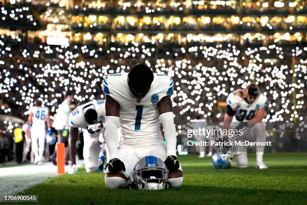 Cameron Sutton of the Detroit Lions kneels on the field prior to the game against the Green Bay Packers at Lambeau Field on September 28, 2023 in...