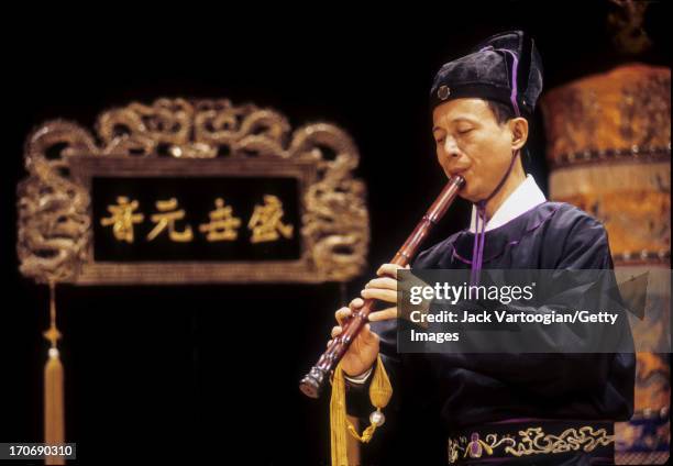 Taiwanese musician Chen Kun-Chin of Taiwan's Han-Tang Yuefu Ensemble plays traditional Chinese 'Nankuan' music on wooden flute at the Taipei Theater...