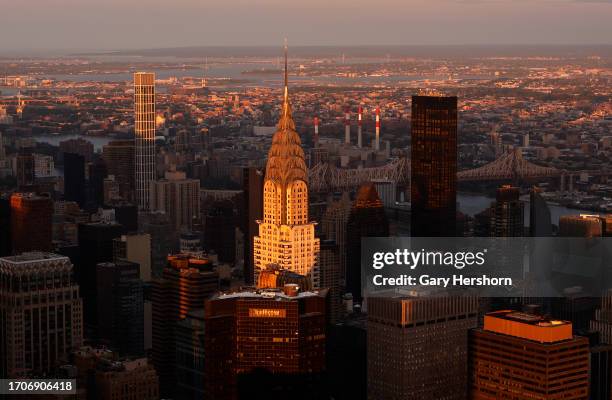 The sun sets on the Chrysler Building seen from the 86th floor of the Empire State Building on September 27 in New York City.