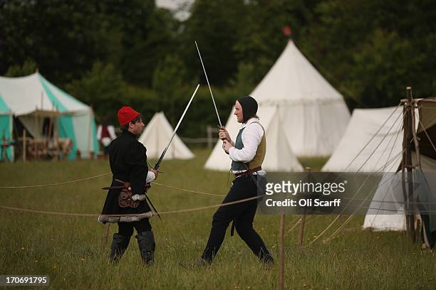 Reenactors in period costume prepare to stage a medieval battle at Eltham Palace on June 16, 2013 in Eltham, England. The 'Grand Medieval Joust'...