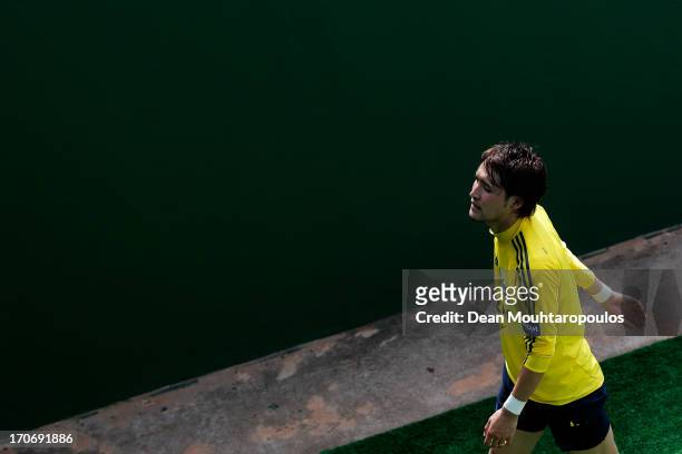 Hajime Hosogai of Japan walks into the players tunnel after the Japan Training Session at Walmir Campelo Bezerra Stadium on June 16, 2013 in...