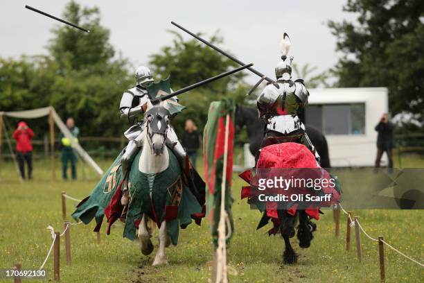 Reenactors dressed as knights stage a medieval jousting competition at Eltham Palace on June 16, 2013 in Eltham, England. The 'Grand Medieval Joust'...