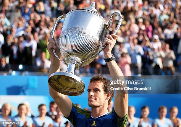 Andy Murray of Great Britain lifts the trophy after victory in the Men's Singles final against Marin Cilic of Croatia on day seven of the AEGON...