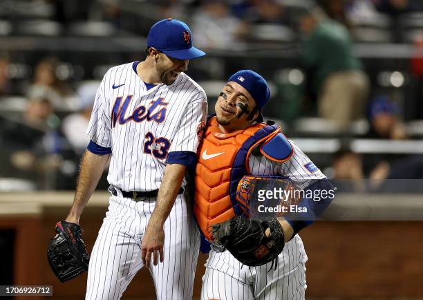 David Peterson and Francisco Alvarez of the New York Mets celebrate after Peterson made the final out of the sixth inning against the Miami Marlins...