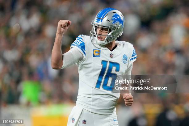 Jared Goff of the Detroit Lions celebrates after David Montgomery scored a touchdown against the Green Bay Packers during the first quarter in the...