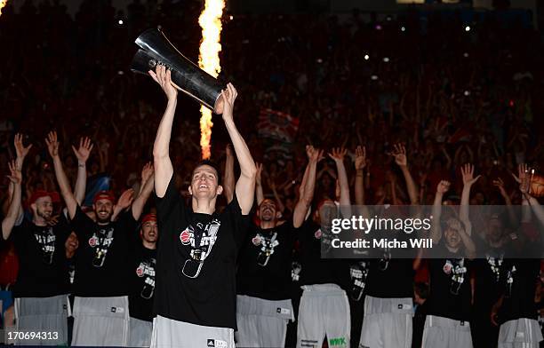 Team captain Casey Jacobsen of Bamberg raises the Beko BBL Cup after winning the finals of the Beko BBL playoffs between Brose Baskets and EWE...