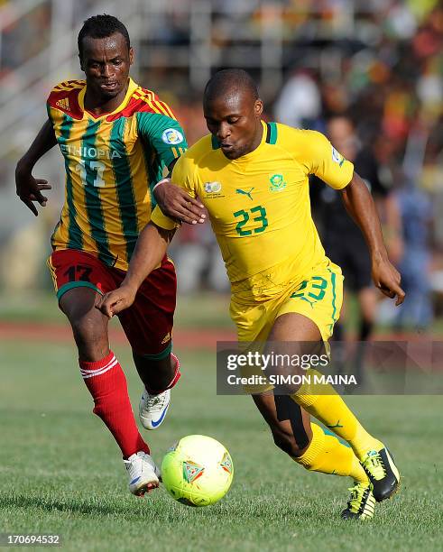 South Africa's Anthony Tokelo vies for the ball with Ethiopia's Seyoum Tesfaye during the 2014 FIFA World Cup qualifying football match Ethiopia vs...