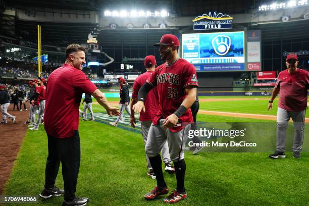 Members of the Arizona Diamondbacks celebrate advancing to the NLDS after taking Game 2 of the Wild Card Series between the Arizona Diamondbacks and...