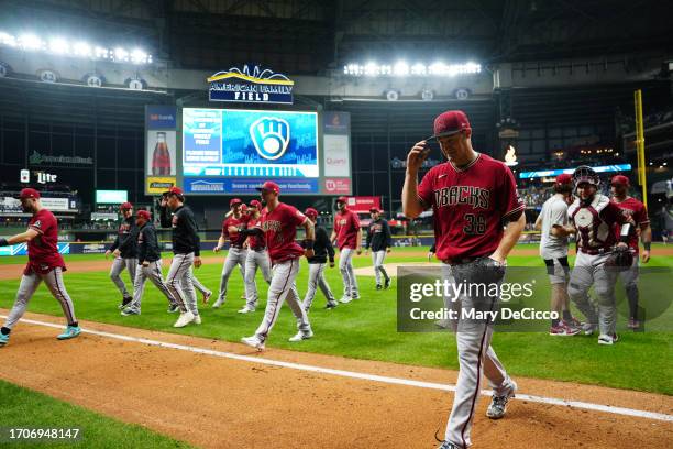 Members of the Arizona Diamondbacks celebrate advancing to the NLDS after taking Game 2 of the Wild Card Series between the Arizona Diamondbacks and...
