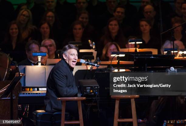 American composer Stephen Schwartz at the piano performs with the New York Pops orchestra and the Essential Voices USA chorus at 'The Wizard and I:...