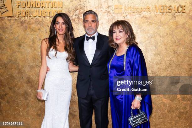 Amal Clooney, George Clooney and Baria Alamuddin attend the Clooney Foundation for Justice's "The Albies" at the New York Public Library on September...