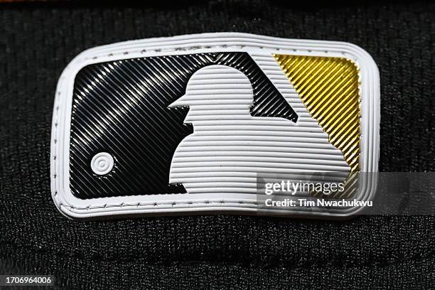 The Major League Baseball logo is seen on a Pittsburgh Pirates uniform during the ninth inning against the Philadelphia Phillies at Citizens Bank...